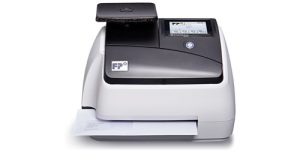 PostBase mini postage meter with envelope